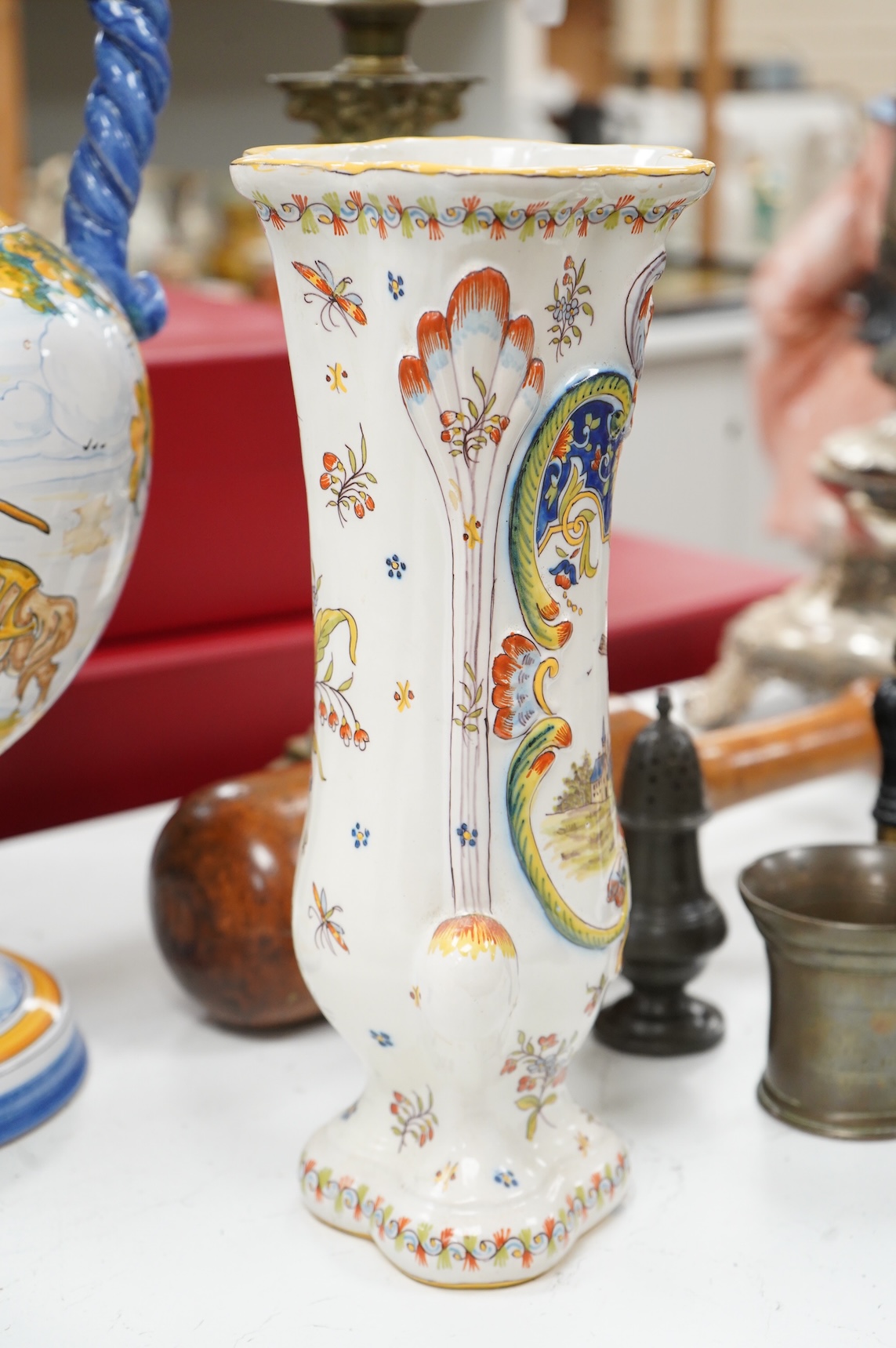 Two large French faience jugs and a vase, and a Talavera twin handled urn/vase, 44cm high